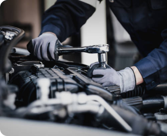 Professional mechanic working on the engine of the car